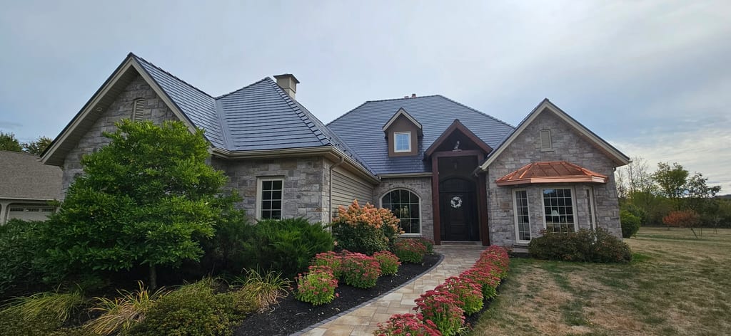 Deep Charcoal Interlock Slate aluminum roof on a ranch style single family home in a rural area, Sussex, New Brunswick