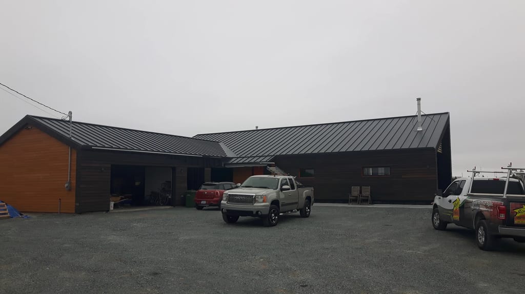 Deep Charcoal Interlock Standing Seam aluminum roof on the home, Cow Bay, Nova Scotia
