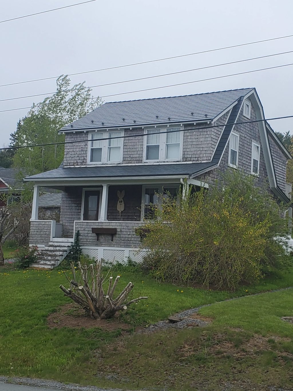 Deep Charcoal Interlock Cedar Shingle aluminum roof on the home, Lunenburg, Nova Scotia