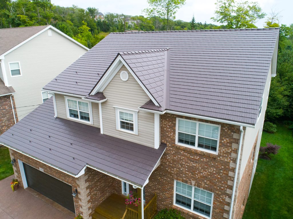 Tudor Brown Interlock Cedar Shingle aluminum roof on a Tudor Brown metal roof on a Colonial home in a forested, Dartmouth, Nova Scotia