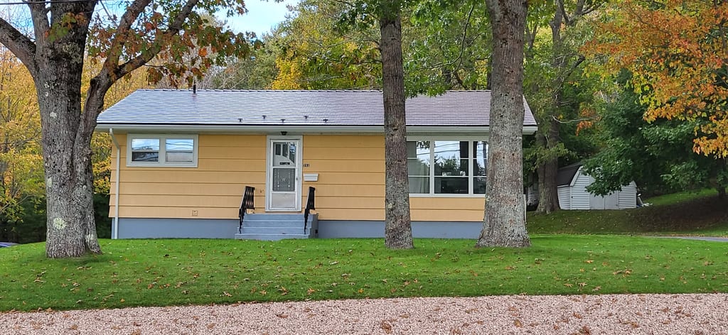 Colonial Brown Interlock Cedar Shingle aluminum roof on the home, Bridgewater, Nova Scotia