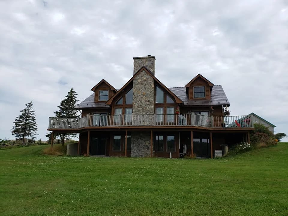 Tudor Brown Interlock Cedar Shingle aluminum roof on the home, Darlings Lake, Nova Scotia