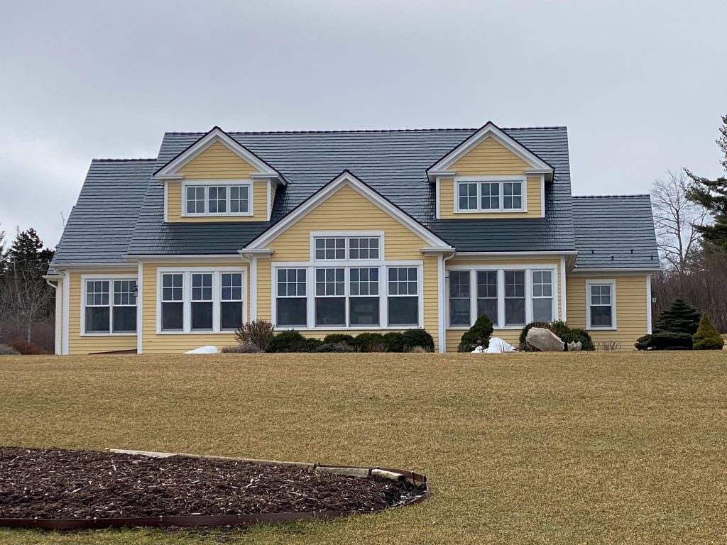 Deep Charcoal Interlock Cedar Shingle aluminum roof on the home, Mahone Bay, Nova Scotia
