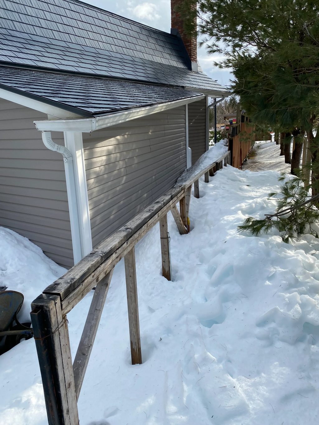 Deep Charcoal Interlock Cedar Shingle aluminum roof on the home with snow guards, Centreville, Nova Scotia