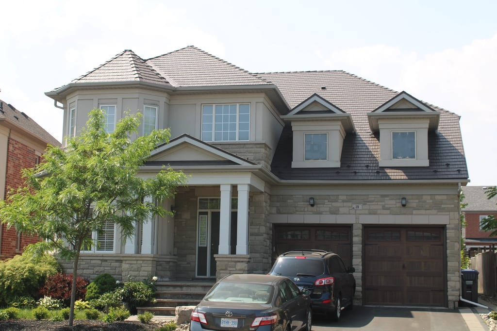 Tudor Brown Interlock Cedar Shingle aluminum roof on a Tudor Brown metal roof on a two-storey Colonial home in a, Brampton, Ontario
