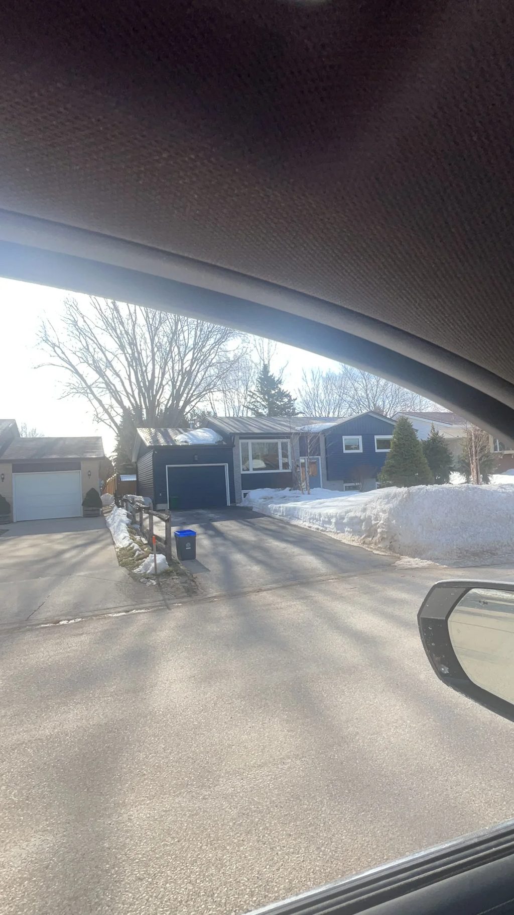Tudor Brown Interlock Slate aluminum roof being installed on the home, replacing an asphalt shingle roof being torn off, Thornbury, Ontario
