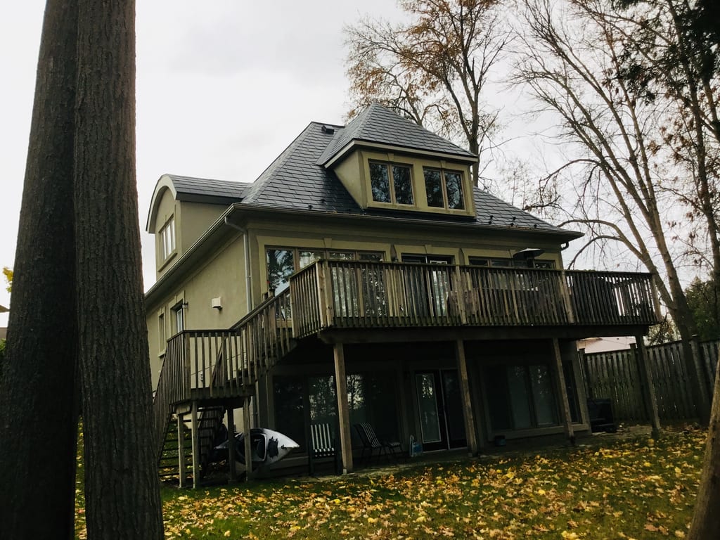 Tudor Brown Interlock Cedar Shingle aluminum roof on a brown two-storey Tudor-style home under construction by, Orillia, Ontario