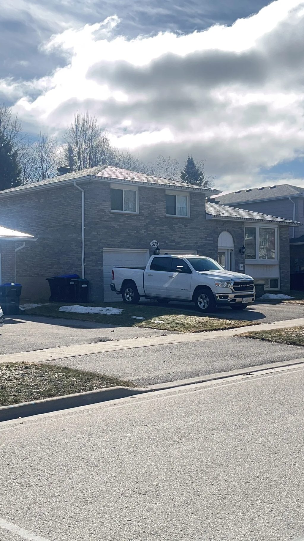 Deep Charcoal Interlock Slate aluminum roof being installed on the home, replacing an asphalt shingle roof being torn off, Bradford, Ontario