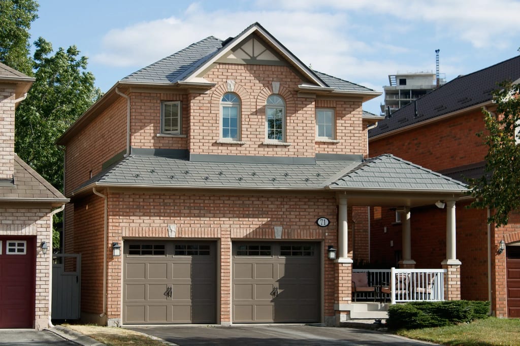 Black Interlock Cedar Shingle aluminum roof on a brick two-storey home with dormers in a suburban, Toronto, Ontario