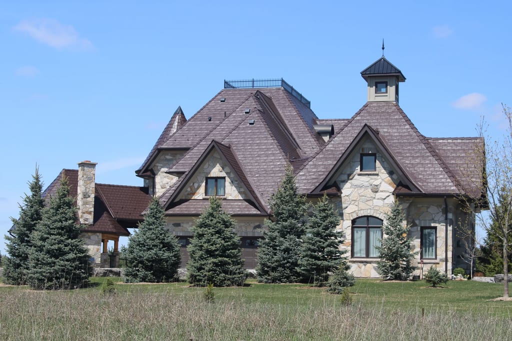 Colonial Brown Interlock Slate aluminum roof on a colonial home with a brown metal roof in a rural setting, Caledon, Ontario