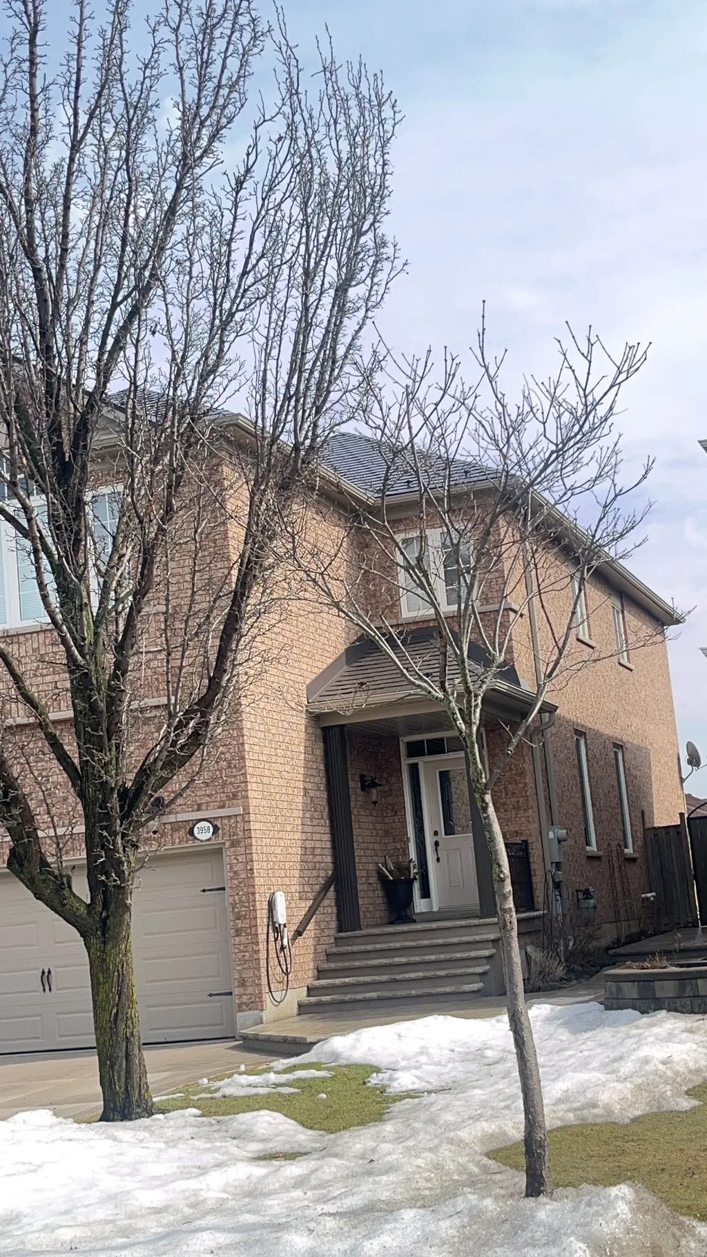 Deep Charcoal Interlock Slate aluminum roof on a two-storey home with an Interlock Slate metal roof in, Mississauga, Ontario