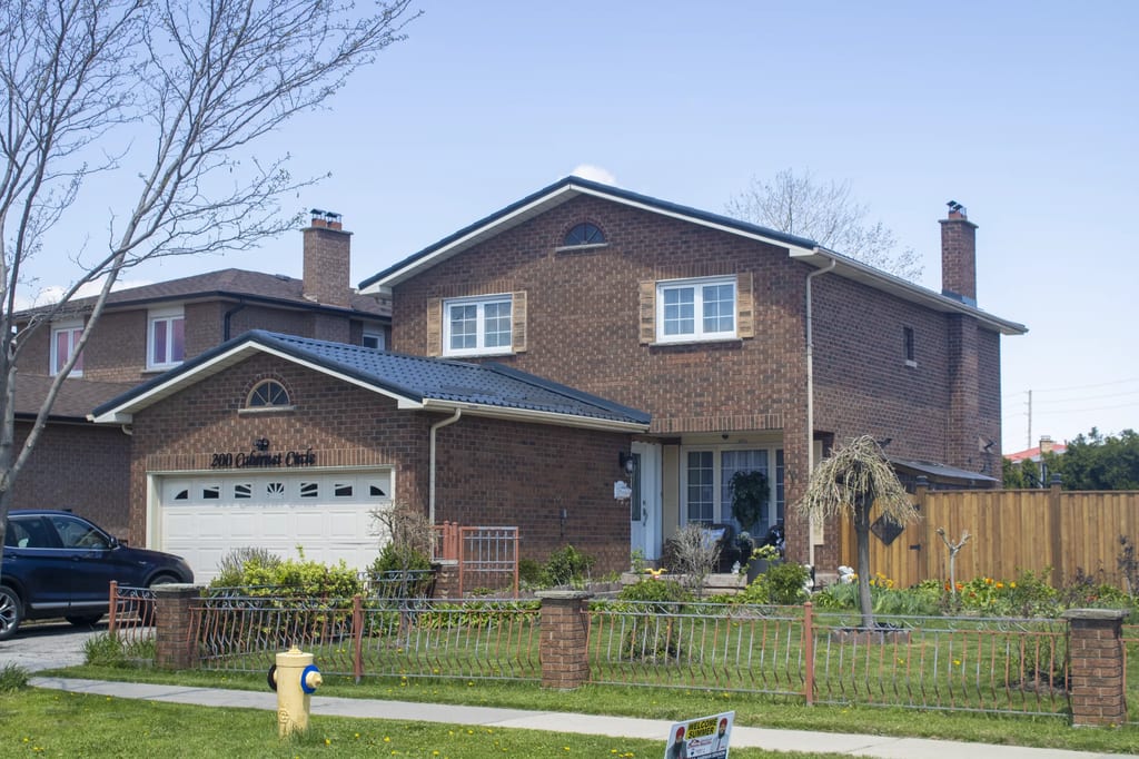 Deep Charcoal Interlock Tile aluminum roof on a two-storey home with a metal roof in Deep Charcoal, Etobicoke, Ontario