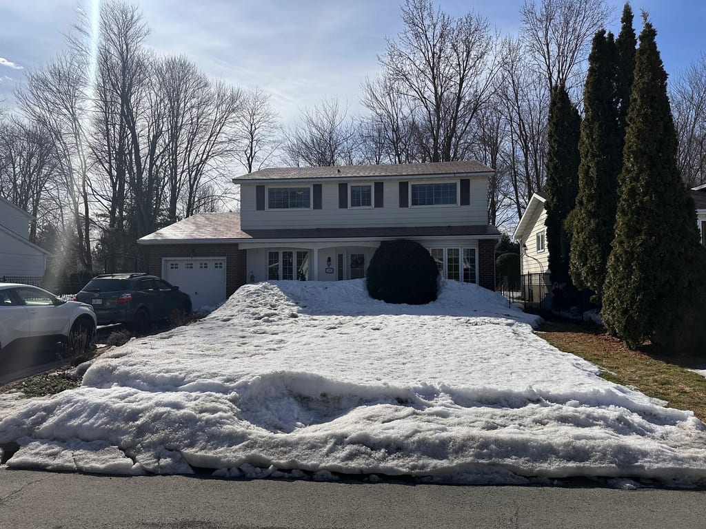 Aged Copper Interlock Shingle aluminum roof on a two-storey home with a metal roof in Aged Copper among, Gloucester, Ontario