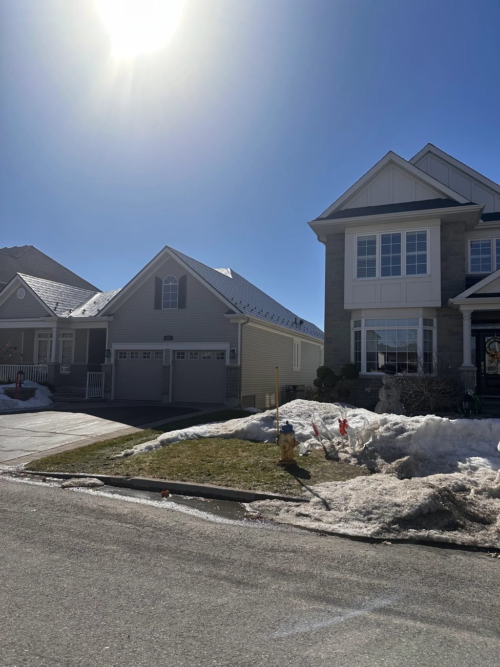 Black Interlock Slate aluminum roof on a colonial-style single-family home in a suburban, Ottawa, Ontario
