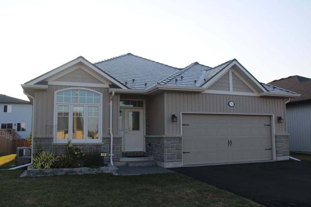 Tudor Brown Interlock Slate aluminum roof on a Tudor-style home in a suburban setting, Belleville, Ontario