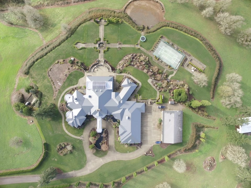 Deep Charcoal Interlock IB Membrane aluminum roof on a single-family home with a metal roof in a rural setting, Turner, Oregon