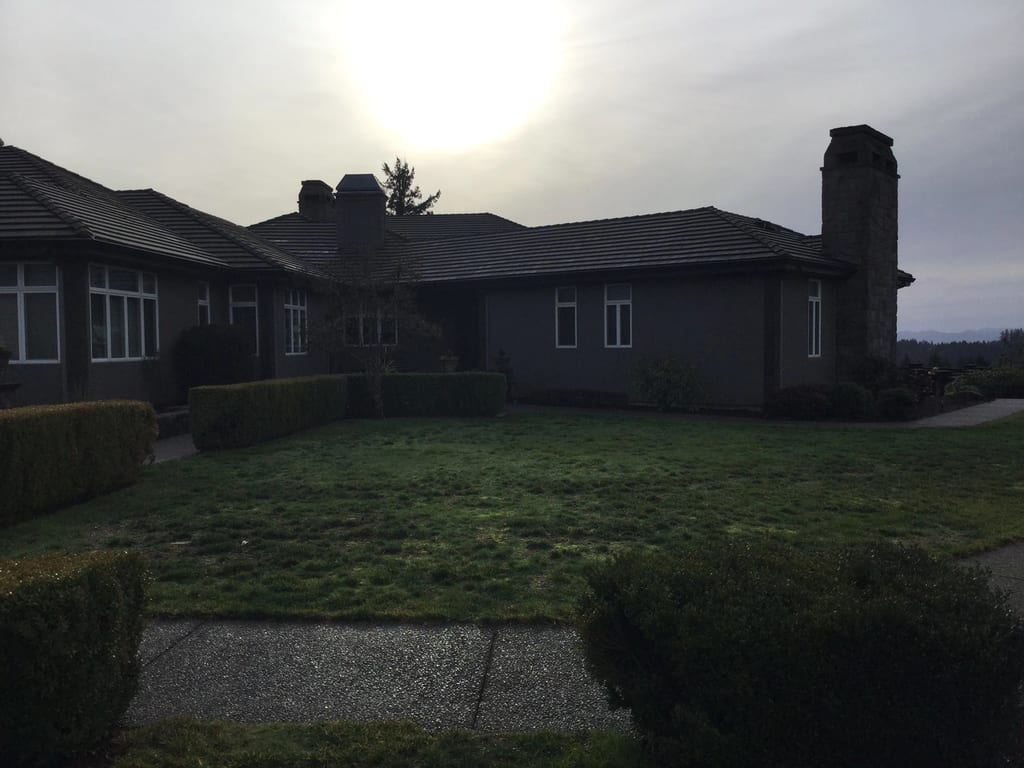 Before: a leaking concrete tile roof on the home, Turner, Oregon, ahead of a Deep Charcoal Interlock IB Membrane aluminum roof