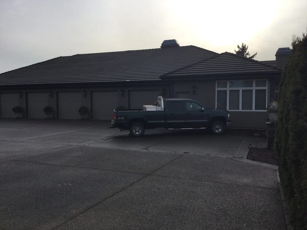 Before: a leaking concrete tile roof on the home, Turner, Oregon, ahead of a Deep Charcoal Interlock IB Membrane aluminum roof