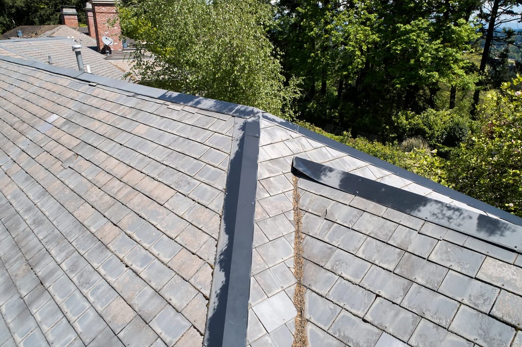 Before: a leaking natural slate roof on the home, Portland, Oregon, ahead of a Deep Charcoal Interlock Slate aluminum roof