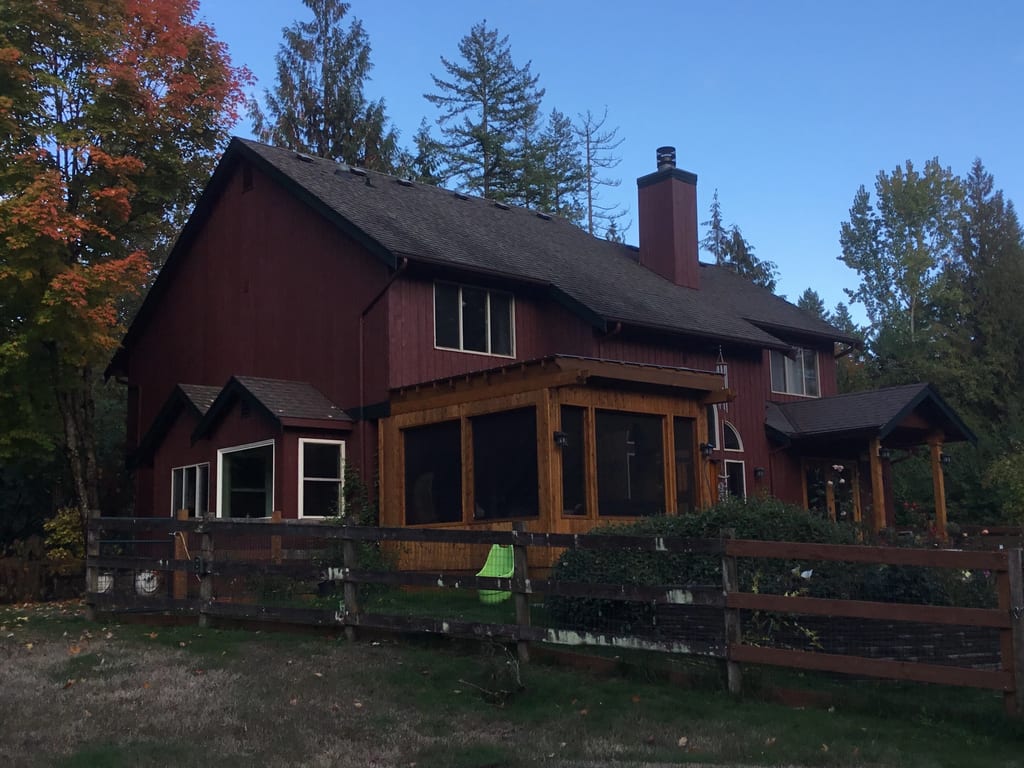 Before: a rotten asphalt shingle roof on the home, Woodinville, Washington, ahead of a Charcoal Grey Interlock Shingle aluminum roof
