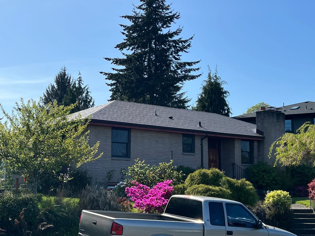 Colonial Brown Interlock Slate aluminum roof on a Colonial brown metal roof on a two-storey home in Seattle, Seattle, Washington