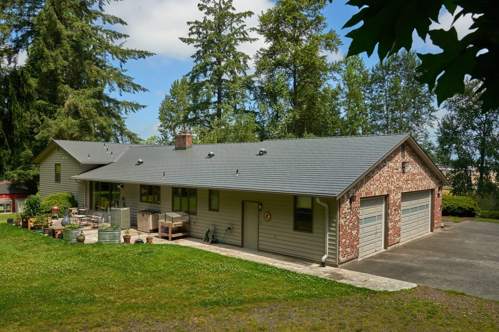 Musket Grey Interlock Cedar Shingle aluminum roof on a Musket Grey metal roof on a two-storey ranch style home, Arlington, Washington