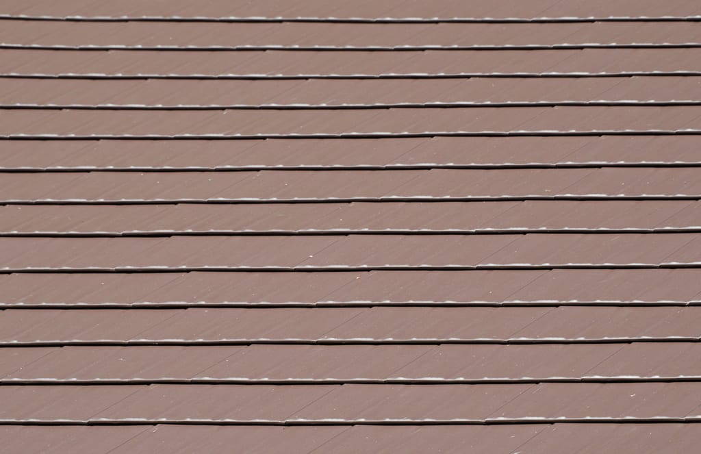 Colonial Brown Interlock Cedar Shingle aluminum roof on a Colonial brown single-family home with two stories among, Shoreline, Washington