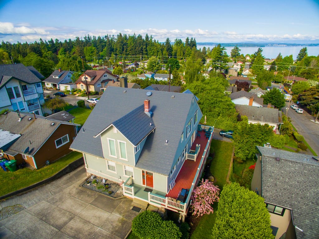 Musket Grey Interlock Slate aluminum roof on a two-storey home with a Musket Grey metal roof in a, Seattle, Washington