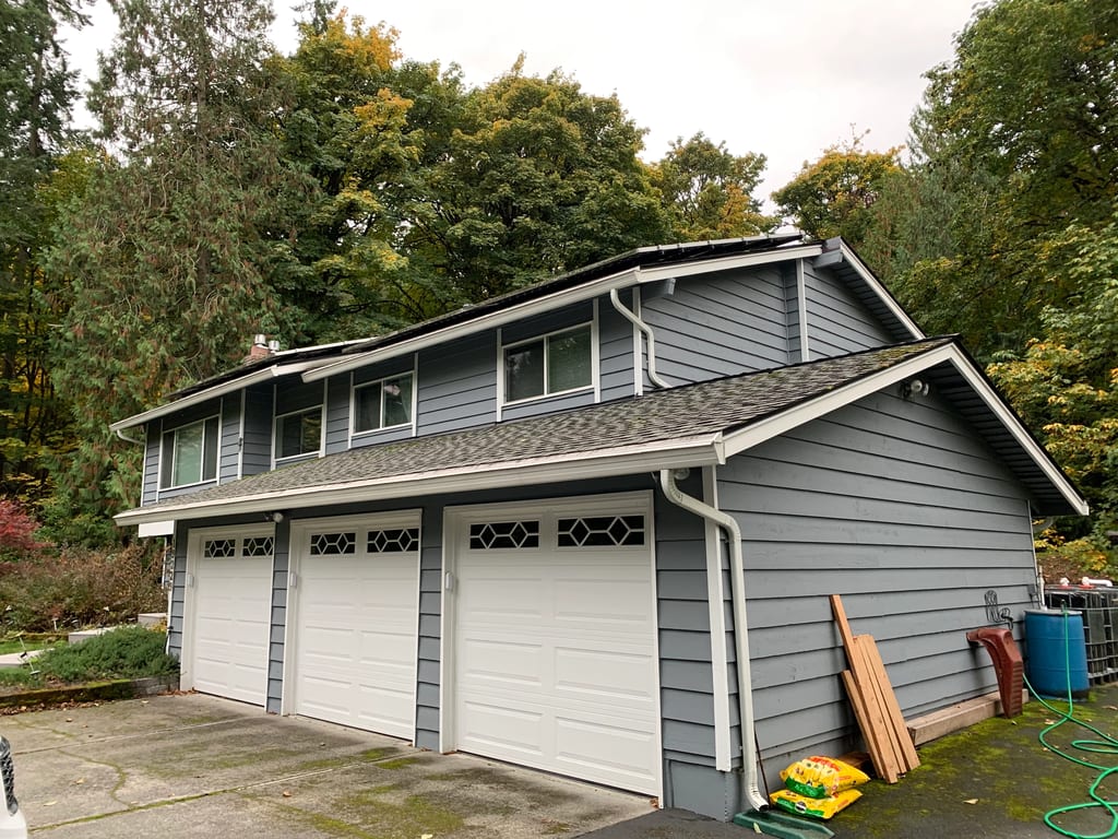 Before: a worn out asphalt shingle roof on the home, Woodinville, Washington, ahead of a Deep Charcoal Interlock Slate aluminum roof