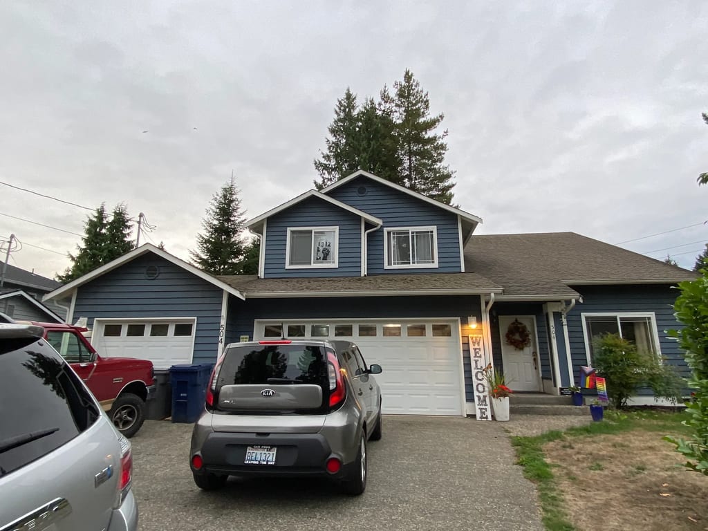 Before: a mossy asphalt shingle roof on the home, Bothell, Washington, ahead of a Musket Grey Interlock Slate aluminum roof