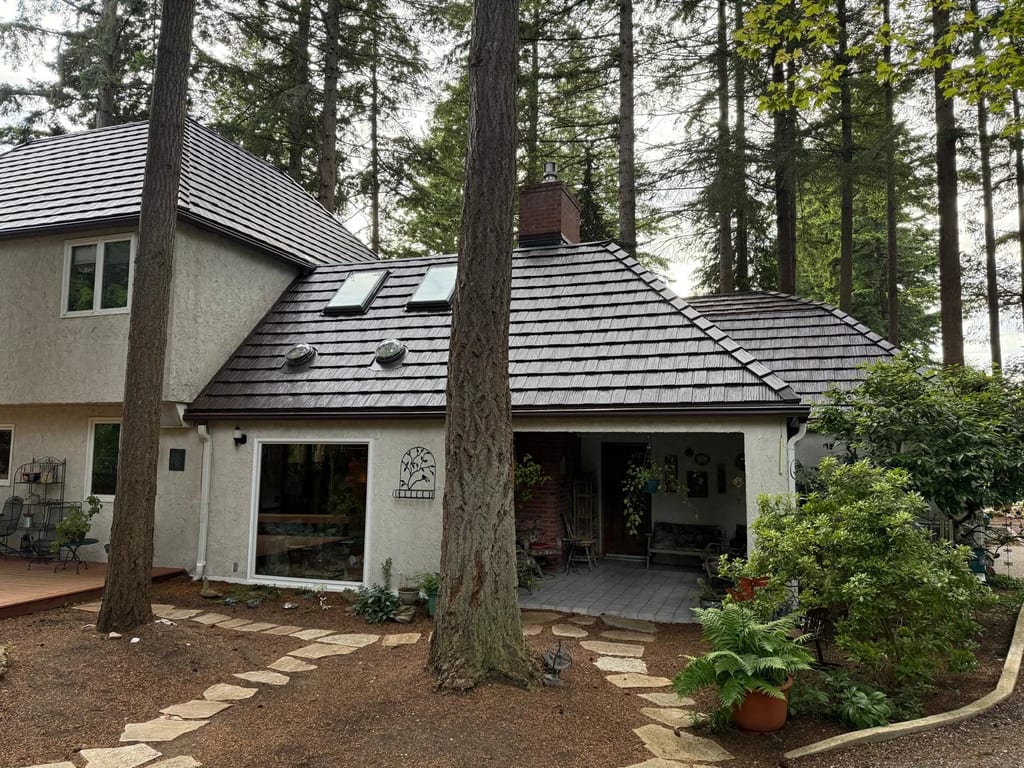 Colonial Brown Interlock Shake aluminum roof on a colonial-style home with a metal roof being installed in, Bellingham, Washington
