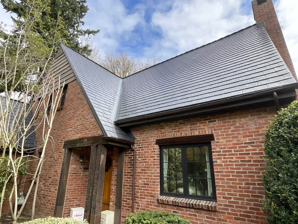 Deep Charcoal Interlock Slate aluminum roof on a deep charcoal metal roof on a brick home in Seattle, Seattle, Washington