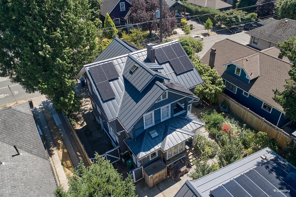 Deep Charcoal Interlock Standing Seam aluminum roof on a deep charcoal metal roof on a two-storey craftsman home, Seattle, Washington