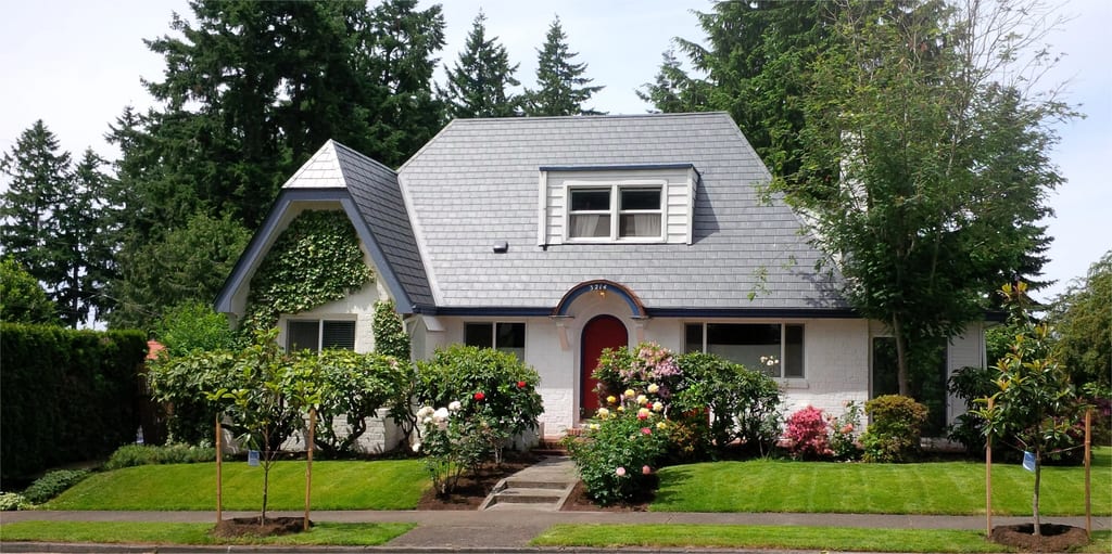 Deep Charcoal Interlock Slate aluminum roof on a white two-storey craftsman home with dormers in a, Vancouver, Washington