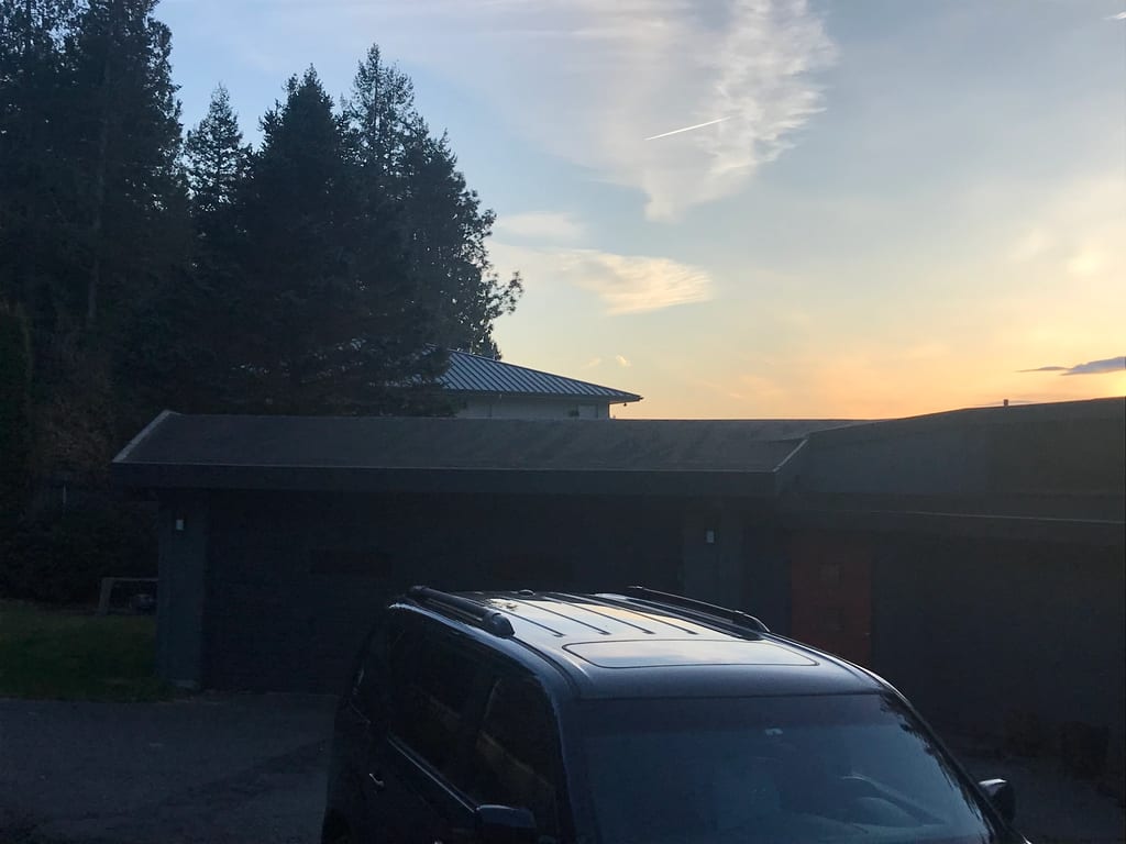 Before: the old roof on the home, Belfair, Washington, ahead of a Musket Grey Interlock Standing Seam aluminum roof