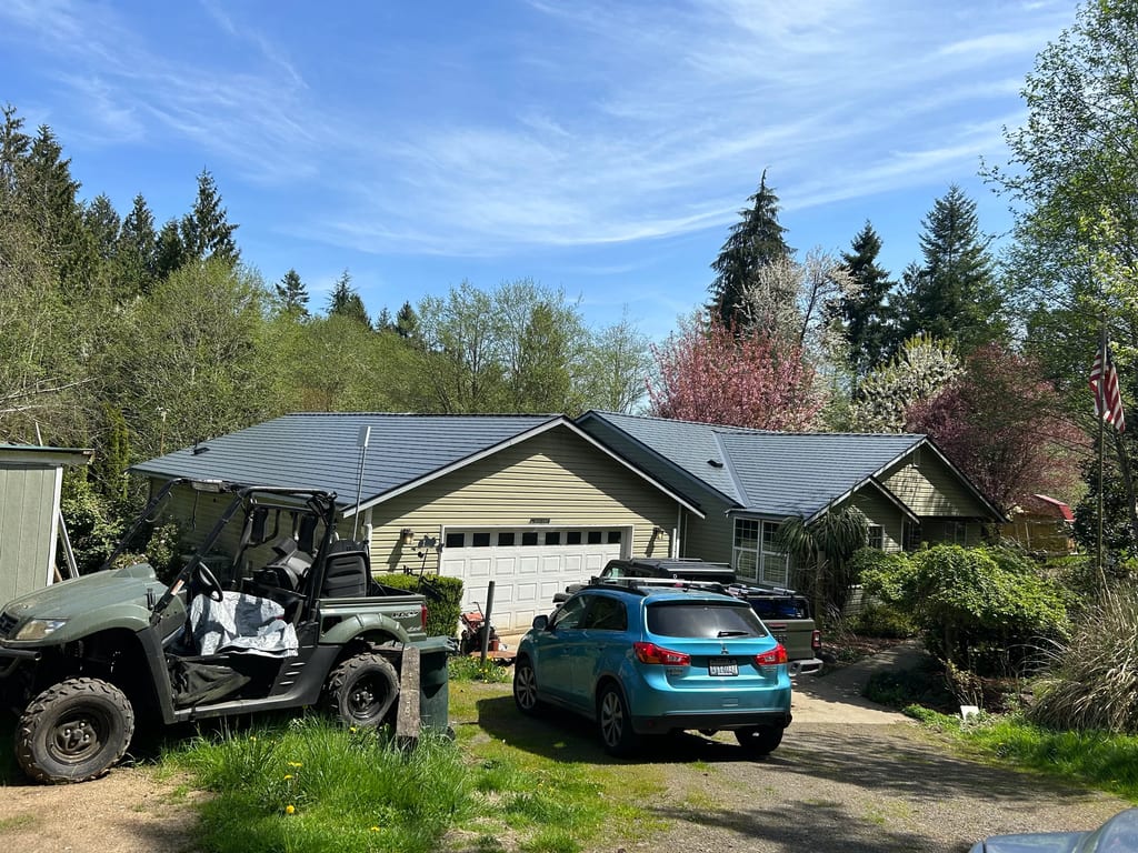 Deep Charcoal Interlock Cedar Shingle aluminum roof on a house with a metal roof in a forested rural area, Longview, Washington