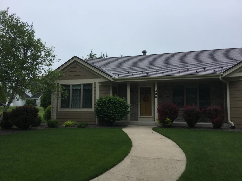 Colonial Brown Interlock Slate aluminum roof on a colonial brown ranch style home in a rural setting, Port Washington, Wisconsin