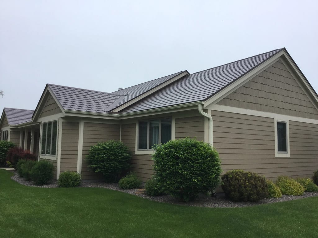Colonial Brown Interlock Slate aluminum roof on a Colonial home with Colonial Brown metal roof on a rural, Port Washington, Wisconsin