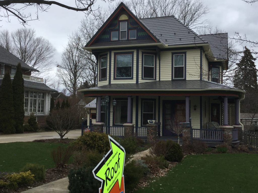 Weathered Interlock Slate aluminum roof on a two-storey Victorian home with dormers in a forested, Mayville, Wisconsin