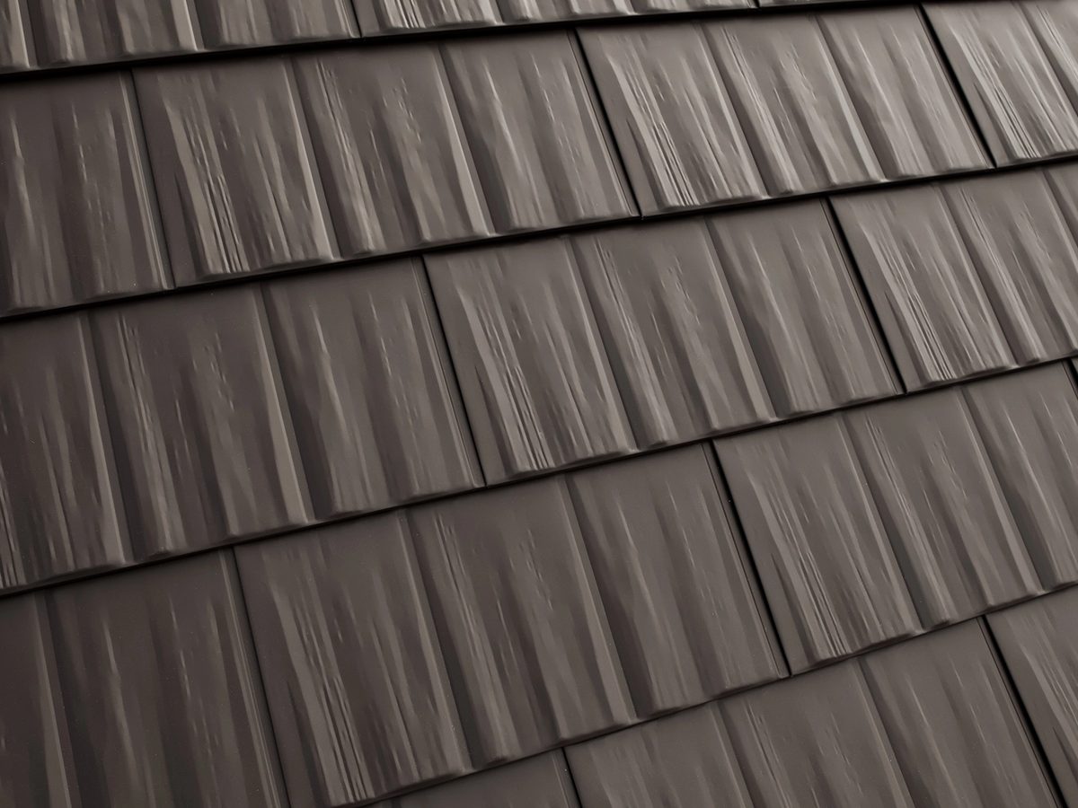 Close-up of Interlock aluminum cedar shingle roofing panels