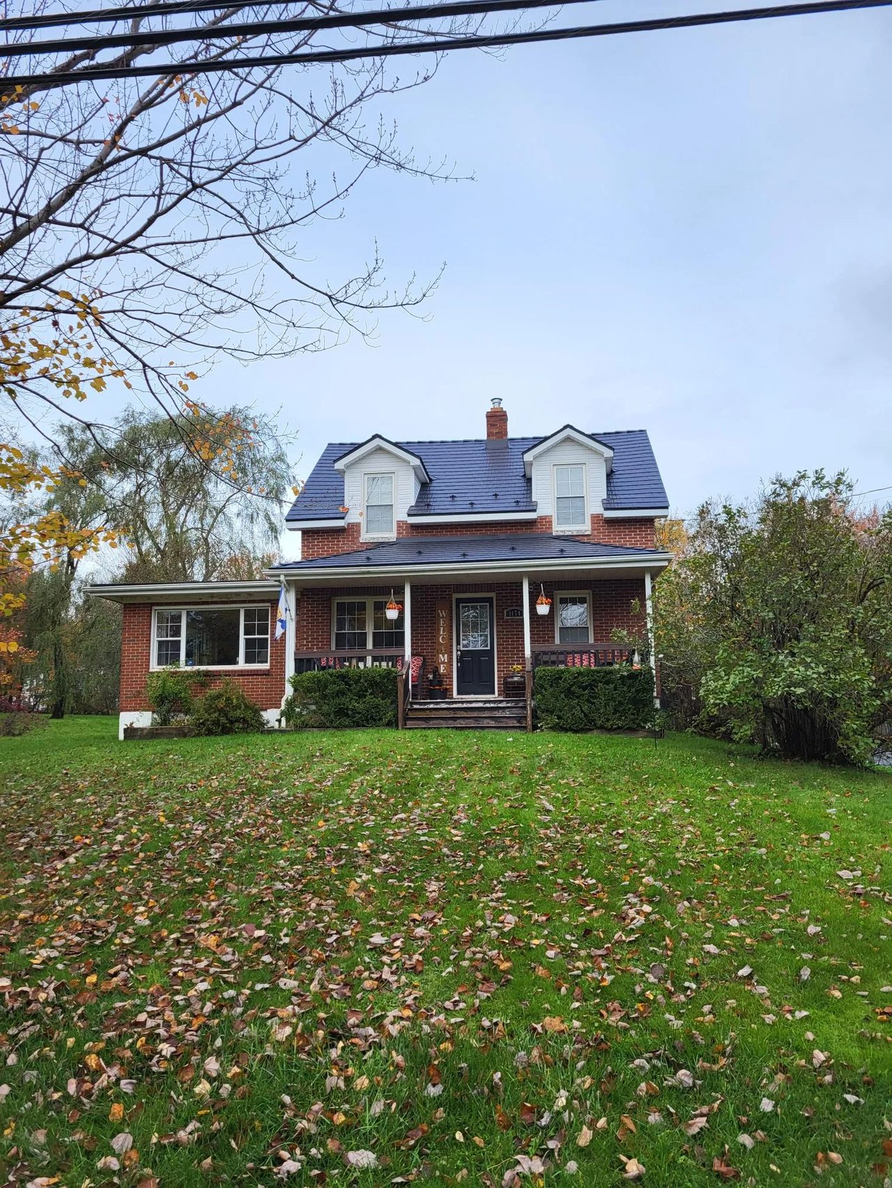 Black Interlock Cedar Shingle aluminum roof on the home, Lantz, Nova Scotia