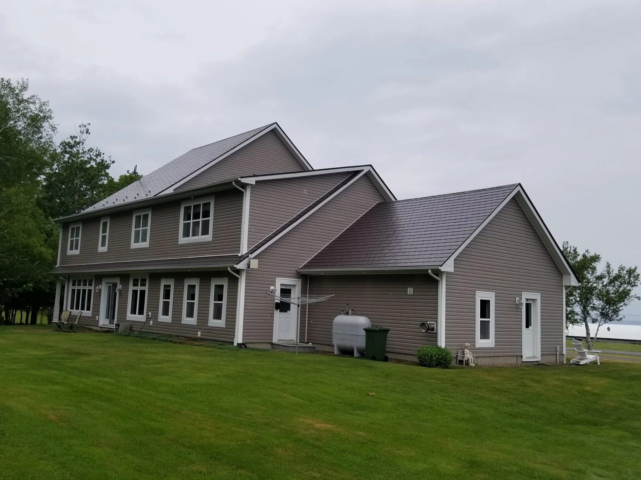 Tudor Brown Interlock Slate aluminum roof on the home, Canning, Nova Scotia
