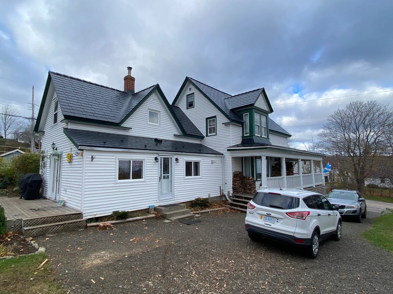 Black Interlock Slate aluminum roof on the home with chimney and dormer, Digby, Nova Scotia