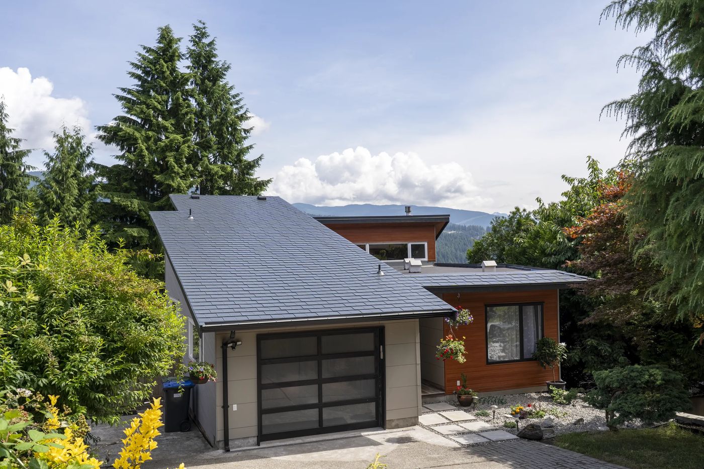 Deep Charcoal Interlock Slate aluminum roof on a modern home with a deep charcoal metal roof in a suburban, Port Moody, British Columbia