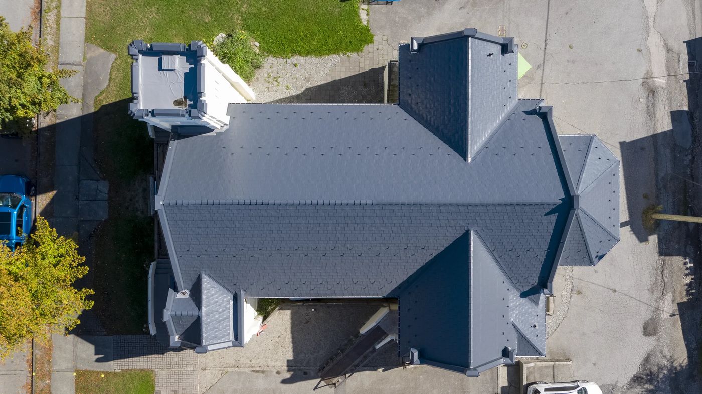 Deep Charcoal Interlock Slate aluminum roof on a modern single-family home in Vancouver, BC with a large, Vancouver, British Columbia