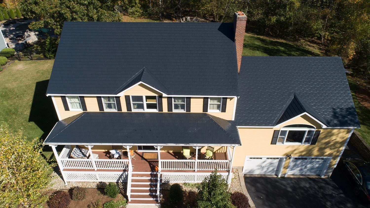 Black Interlock aluminum slate roof on a Colonial home in Reading, MA — Aerial front view