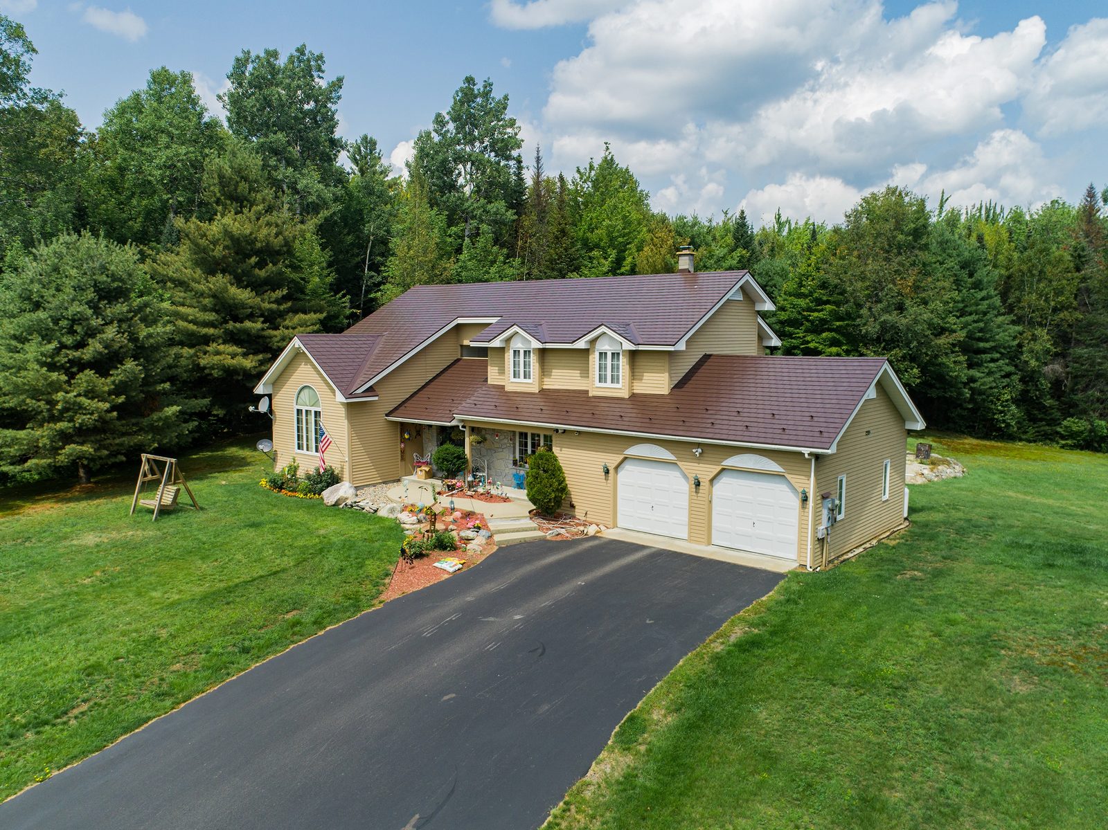 Colonial Brown Interlock aluminum slate roof on a Colonial home in Milan, NH — Aerial front view