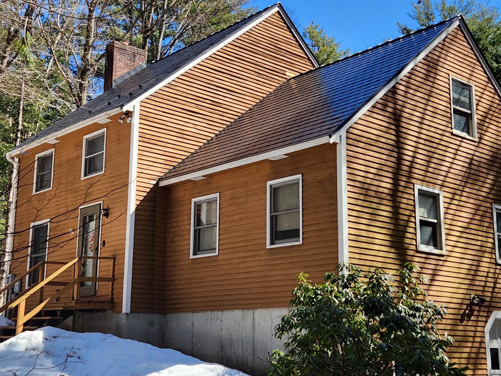 Black Interlock aluminum slate roof on a Colonial home in Sanbornville, NH — Rear-left elevation view