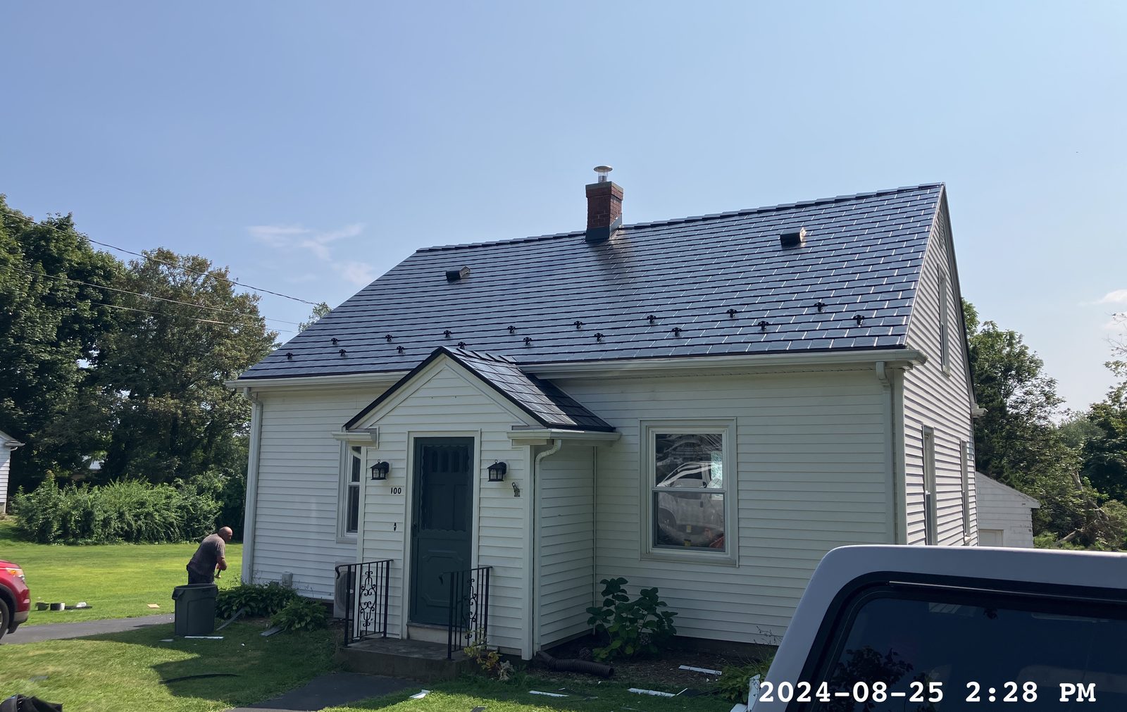 Black Interlock aluminum slate roof on a Cape Cod home in Portsmouth, RI — Front elevation view