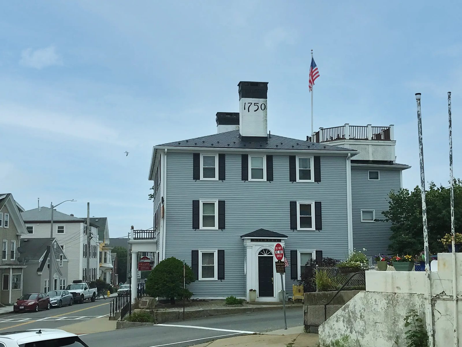 The historic Samuel Gilbert House in Gloucester, MA with a black Interlock aluminum slate roof